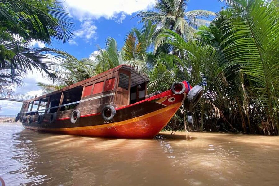 Authentic Mekong Delta: Tuk Tuk, Rowing Boat, Biking Tour - The Tien River motorboat and Qui Islet (Tortoise Islet)