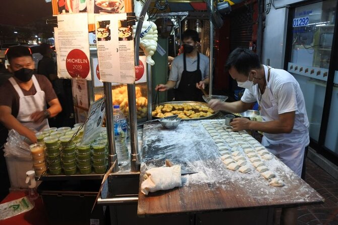 Chinatown Street Food Night Tour by Tuk Tuk in Bangkok - Wat Ratchanatdaram and the Grand Palace exterior: temple glow without the day-tour overload