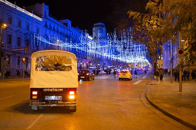 Christmas Lights Tour of Madrid in Eco Tuk Tuk Private - Neptune and the Prado zone: the fountains and paintings meet