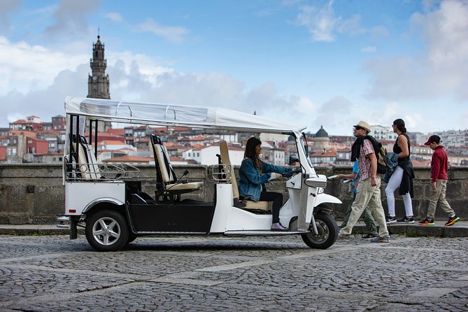 Discover Porto's Highlights on a 2-Hour Private Electric Tuk Tuk - Cordoaria and Clérigos: viewpoints with built-in photo logic