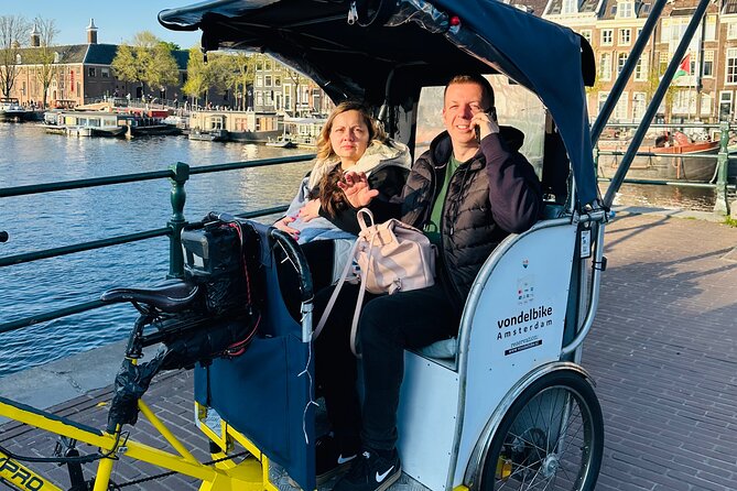 Explore Amsterdam in 75 Minutes – Pedicab Rickshaw City tour - Stop 2: Dam Square for landmark energy and easy orientation