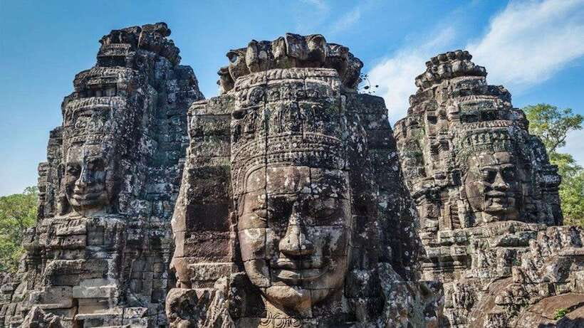 Full Day Private of Angkor Wat Tour with Tuk Tuk - Angkor Thom and Bayon: smiling stone faces with jungle around