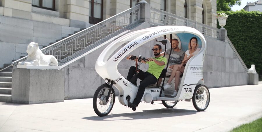 Geneva: Highlight Tour in TukTuk - The must-sees: Jet d’Eau, Flower Clock, and Reformers Wall