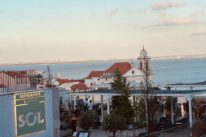 Lisbon City 4 hour Private eco Tuk Tuk Tour: Love at First sight - Alfama views at Miradouro das Portas do Sol: where the red roofs show up