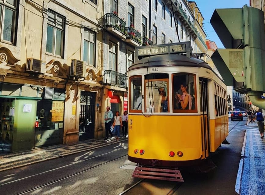 LISBON GRAND EXPERIENCE Tuktuk Tour in German - Lisbon Cathedral, Baixa, and Santa Luzia: the city’s pivot point