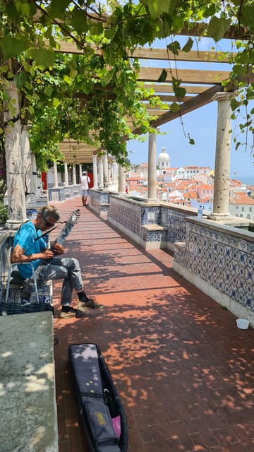 Lisbon: Tuk Tuk 2H Tour Lisbon with a Old Timer - Miradouro das Portas do Sol and Santa Luzia: a classic viewpoint route