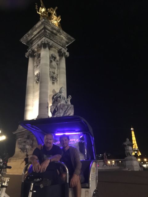 Paris: Nighttime Tuk-Tuk Tour - Champs-Élysées at night: the boulevard glow, up close