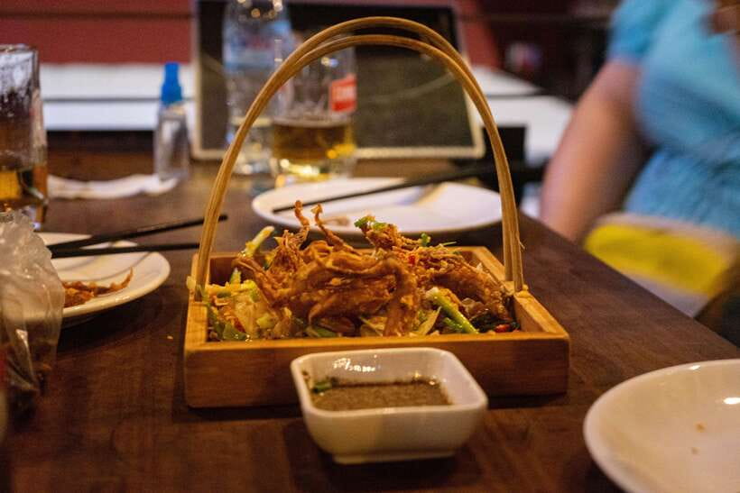 Phnom Penh: Evening Food Tour with Drinks & Tuk Tuk Included - BBQ chicken and sticky pork ribs at Russian Market