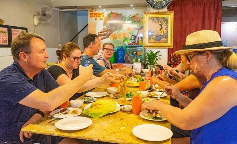 Phnom Penh: Night Foodie Tour by Tuk Tuk with Drinks - Meeting Your Guide and Hitting the Riverfront by Tuk-Tuk