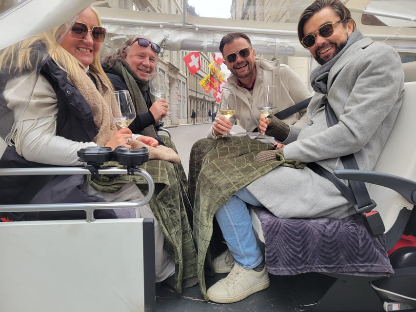Private Highlights Top Places Tour Electric TukTuk 1h15 - Music, drinks, and cozy comfort in Swiss weather
