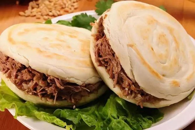 Private Xi'an Foodie Tour by Tuktuk - Logistics you should plan for: shoes, walking, and meeting point